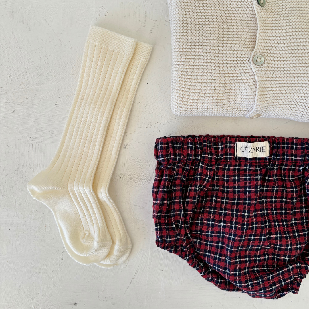 Chaussettes hautes en maille côtelée crème